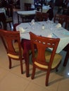 TABLE AND WOODEN CHAIRS IN RESTAURANT AND HOTEL