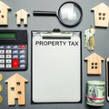 Table with wooden houses, calculator, coins, magnifying glass with the word Property Tax. Property taxes. Calculation of interest