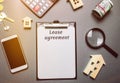 Table with wooden houses. Real estate. Lease agreement is a contract between a lessor and a lessee that allow lessee rights to use Royalty Free Stock Photo