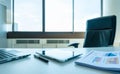 Table work in empty office room with tablet and report Royalty Free Stock Photo