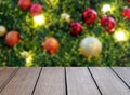 empty dark brown wooden table top with blurred colorful ornament ball and lights on christmas tree background Royalty Free Stock Photo