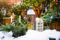 Table in yard of a country house with New Year`s decoration covered with snow Royalty Free Stock Photo