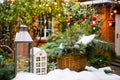 Table in yard of a country house with New Year`s decoration covered with snow Royalty Free Stock Photo