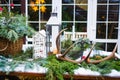 Table in yard of a country house with New Year`s decoration covered with snow Royalty Free Stock Photo