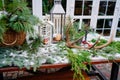 Table in yard of a country house with New Year`s decoration covered with snow Royalty Free Stock Photo