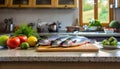 A selection of fresh fish: trout, sitting on a chopping board against blurred kitchen background copy space