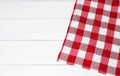 Tablecloth with checkered pattern on white wooden table, top view. Space for text Royalty Free Stock Photo