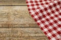 Tablecloth with checkered pattern on wooden table, space for text Royalty Free Stock Photo