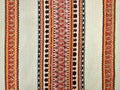 Tablecloth embroidered with threads, close-up, top view, Ukrainian traditions.