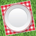 Tablecloth and empty plate on green grass, vector Royalty Free Stock Photo