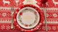 tablecloth, plate and cutlery with Christmas drawings Royalty Free Stock Photo