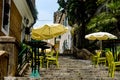 Tables of a cafe on the stairs of the old city in Montenegro Royalty Free Stock Photo