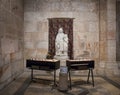 Tables with candles stand in front of the statue in the Church of Saint Anne near Pools of Bethesda in the old city of Jerusalem,