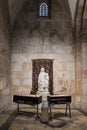 Tables with candles stand in front of the statue in the Church of Saint Anne near Pools of Bethesda in the old city of Jerusalem,