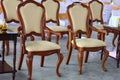 Tables and chairs arranged in a row for a meeting or seminar. Royalty Free Stock Photo