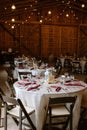 Tables and chairs arranged in a rustic wedding setting Royalty Free Stock Photo