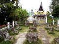 Tables and chairs carved in stone in a Catholic cemetery on Lake Toba, Pulau Samosir. Indonesia