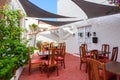 Tables with chairs in a restaurant on Menorca.