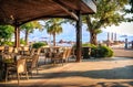 Tables and chairs in a hotel bar in a resort and sea, Marmaris, Turkey Royalty Free Stock Photo