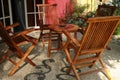Tables and chairs in a small restaurant.outdoor cafe. sitting wooden folding armchair