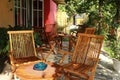 Tables and chairs in a small restaurant.outdoor cafe. sitting wooden folding armchair
