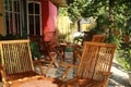 Tables and chairs in a small restaurant.outdoor cafe. sitting wooden folding armchair