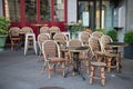 Tables and chairs in street cafe in Europe at morning after party Royalty Free Stock Photo