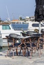 Tables and chairs of a street cafe Greece, Peloponnese Royalty Free Stock Photo