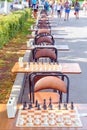 Tables with a chessboard prepared for chess players on the Volga embankment