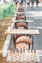 Tables with a chessboard prepared for chess players on the Volga embankment