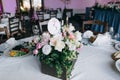 Tables decor in the restaurant at wedding ceremony, flowers, food and number table Royalty Free Stock Photo