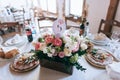 Tables decor in the restaurant at wedding ceremony, flowers, food and number table Royalty Free Stock Photo