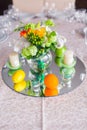 Tables decorated with flowers and fruit Royalty Free Stock Photo