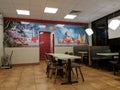 Tables and Hawaii Mural inside Jack in the Box Restaurant