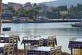 Tables of a restaurant near the sea, very typical in Greece Royalty Free Stock Photo