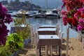 Tables of a restaurant near the sea very typical in Greece Royalty Free Stock Photo