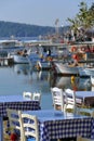 Tables of a restaurant near the sea, very typical in Greece Royalty Free Stock Photo