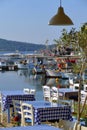 Tables of a restaurant near the sea, very typical in Greece Royalty Free Stock Photo