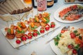 Tables in the restaurant with snacks and dishes. Easy food for guests. Business lunch. Preparing for wedding banquet. Smorgasbord