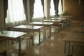 Tables in school canteen. Tables with benches stand in row. Lunch room. School room