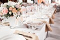 Tables set for an event party or wedding reception. luxury elegant table setting dinner in a restaurant. glasses and Royalty Free Stock Photo