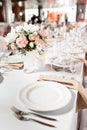 Tables set for an event party or wedding reception. luxury elegant table setting dinner in a restaurant. glasses and Royalty Free Stock Photo