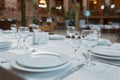 Tables set for meal . fork, knife . empty glasses and plates on the table in the restaurant Royalty Free Stock Photo