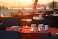 Tables set for meal on restaurant terrace Royalty Free Stock Photo