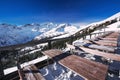 Tables on terrace covered by fresh snow near ski slopes on the t