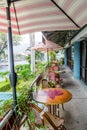 Tables Under Umbrellas on Tropical Patio