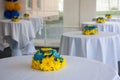 Tables with white tablecloths decorated with flowers