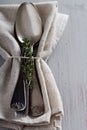 Tablespoons with a napkin and thyme Royalty Free Stock Photo