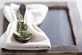 Tablespoons with a napkin and thyme Royalty Free Stock Photo