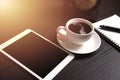 Tablet and black coffee on wooden table with Digital Earth world Royalty Free Stock Photo